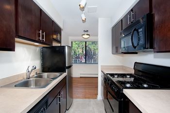 Spacious Kitchen with Pantry Cabinet at Reside on Pine Grove, Chicago, IL,60613